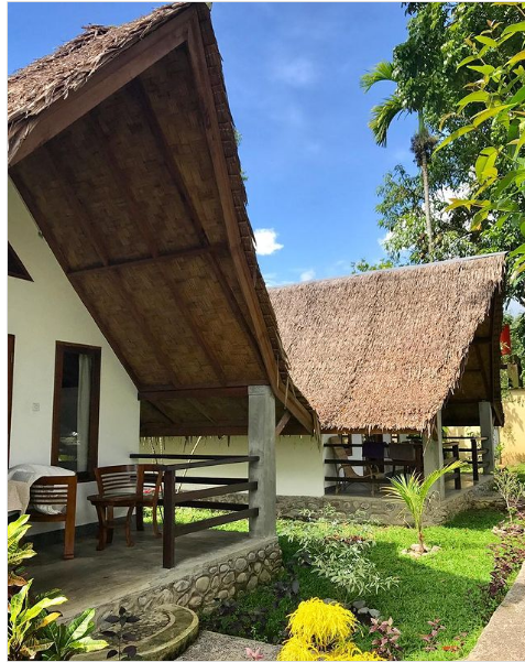 Wooden bungalow with a private balcony at Villa Paradise guest house in Bukit Lawang, North Sumatra